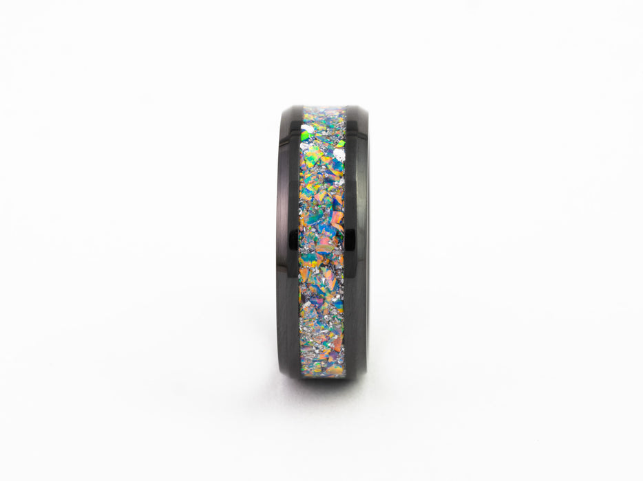 Side profile close-up of the Black Ceramic Ring showing the colorful fire opal flake inlay band detail.