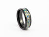 Angled studio shot of the Black Ceramic Ring with multi-color fire opal flake inlay band.