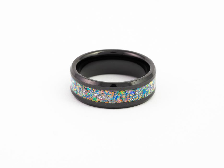 Top view of the Black Ceramic Ring showcasing the wide multi-color fire opal flake inlay and the detailed milgrain edges.
