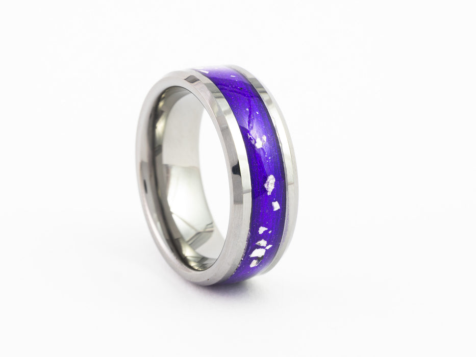 Angled studio shot of the Silver Tungsten Carbide Ring with stunning purple resin and silver leaf flake inlay.
