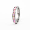 Slim Tungsten Carbide Ring with pink synthetic fire opal inlay, studio shot on white background.