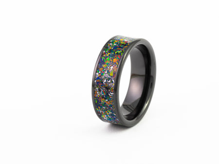 Black Ceramic Ring with wide, dark nebula-style multicolored fire opal inlay and flecks of silver leaf.