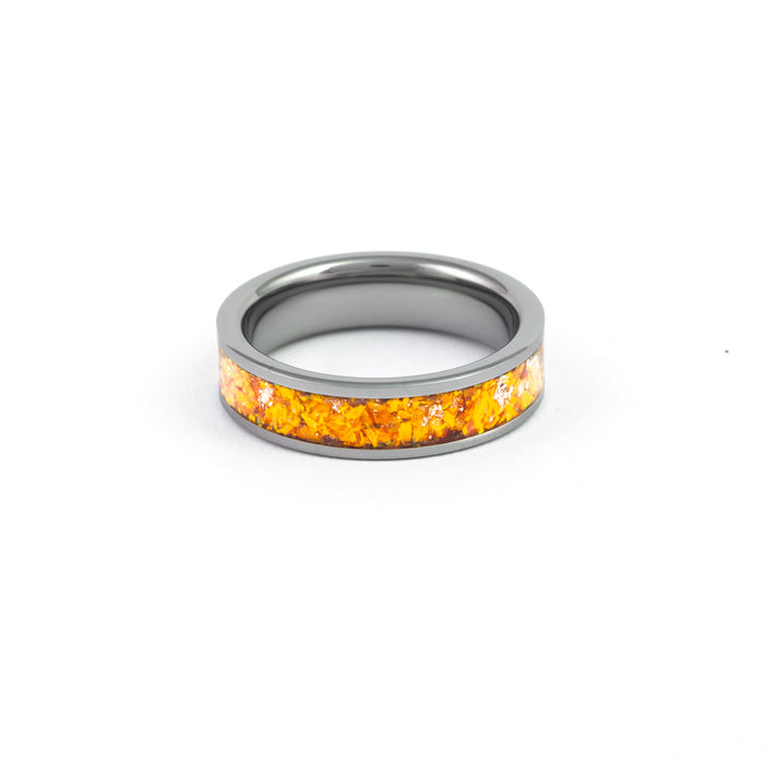 Top view of the Gunmetal Tungsten Ring showcasing the orange synthetic fire opal inlay and detailed edges.