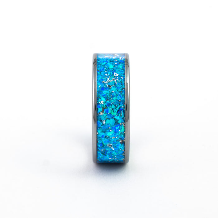 Side view of the Gunmetal Tungsten Carbide Ring detailing the wide, vibrant blue fire opal inlay.