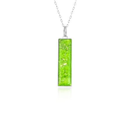 Sterling silver chain necklace with a rectangular bar pendant featuring bright lime green resin and silver flake accents.