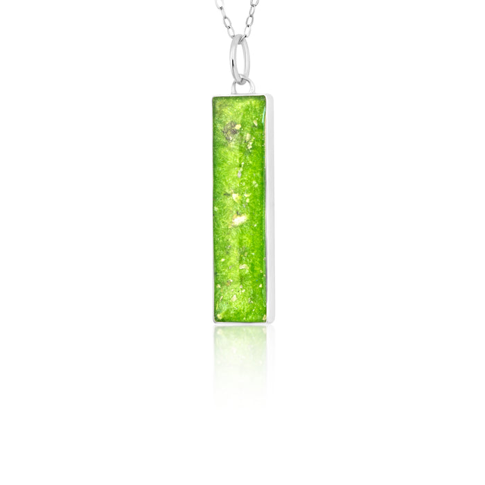 Sterling silver chain necklace with a rectangular bar pendant featuring bright lime green resin and internal silver flake accents.