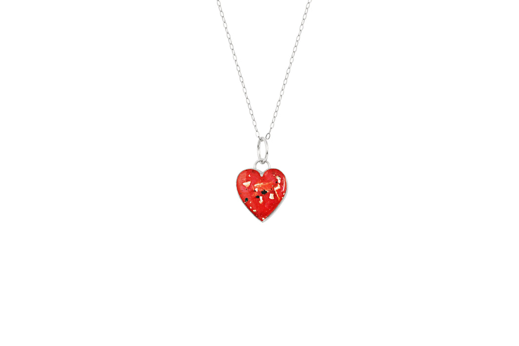 Sterling silver heart pendant necklace with red resin inlay and gold flake accents.