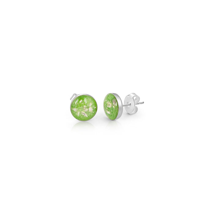 Pair of sterling silver stud earrings featuring round bright green opal resin inlays with the posts clearly visible.