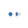 Pair of sterling silver stud earrings featuring round blue opal resin inlays with the posts clearly visible.