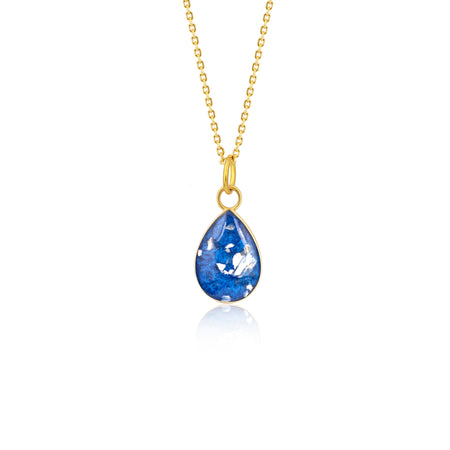 Gold-plated chain necklace with a pear-cut teardrop pendant featuring vibrant blue resin and internal silver flake accents.