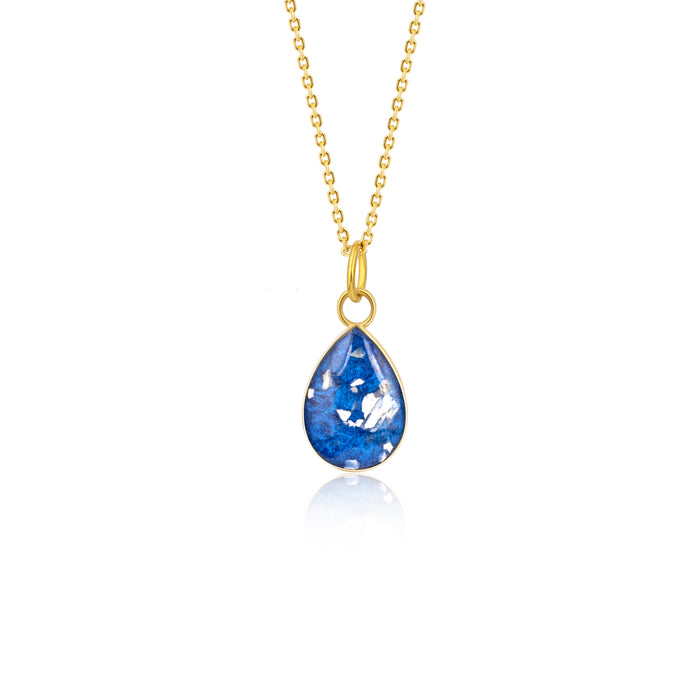 Gold-plated chain necklace with a pear-cut teardrop pendant featuring vibrant blue resin and internal silver flake accents.
