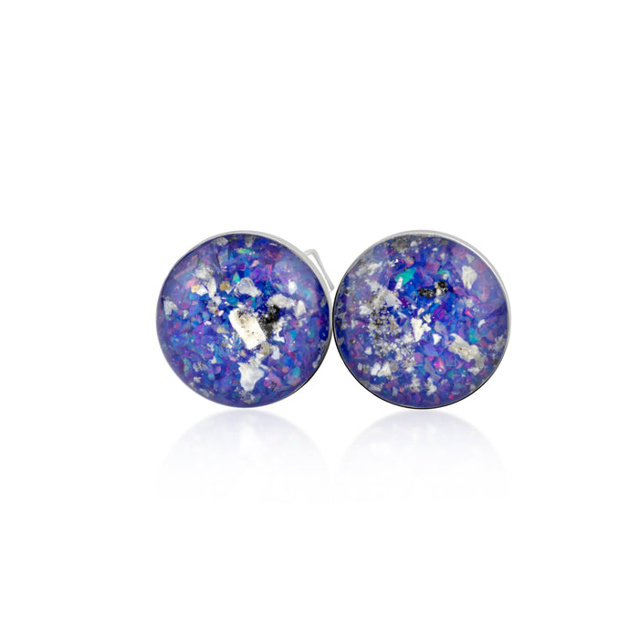 Pair of sterling silver stud earrings featuring round blue and purple opal resin inlays with internal silver flakes.
