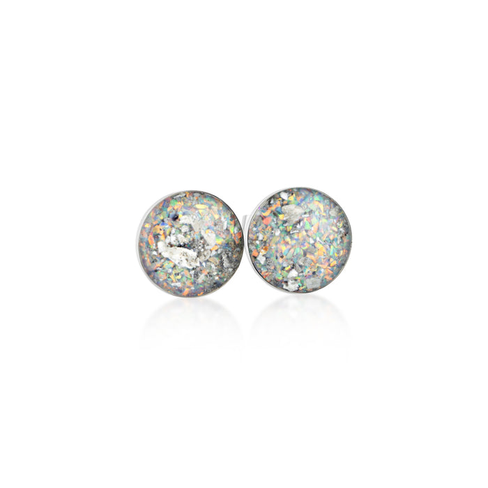Pair of sterling silver stud earrings featuring round white and silver opal resin inlays with holographic shimmer.