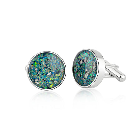 Pair of sterling silver cufflinks featuring round blue and green opal resin inlays with internal silver flakes.