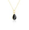 Gold-plated chain necklace with a pear-cut teardrop pendant featuring black resin and subtle white flake accents.