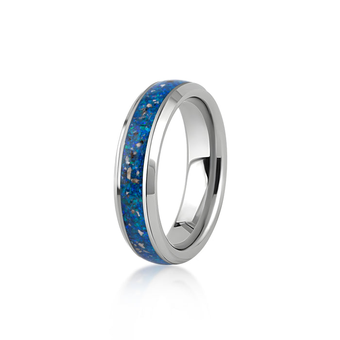 Sterling silver band ring featuring a continuous inlay of bright blue opal resin and scattered silver flakes.