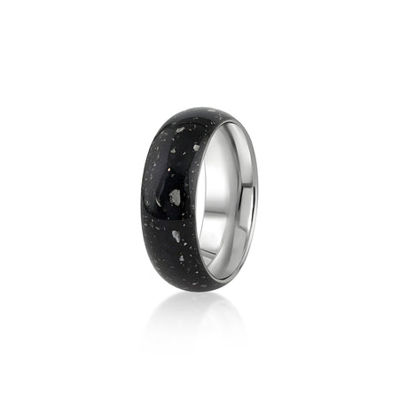 Sterling silver band ring featuring a continuous inlay of black resin with scattered white and silver flakes.
