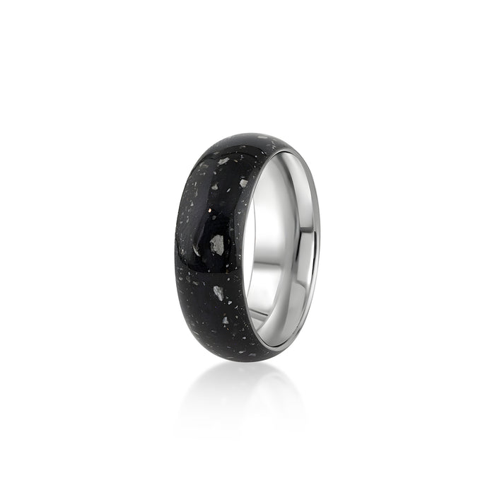 Sterling silver band ring featuring a continuous inlay of black resin with scattered white and silver flakes.
