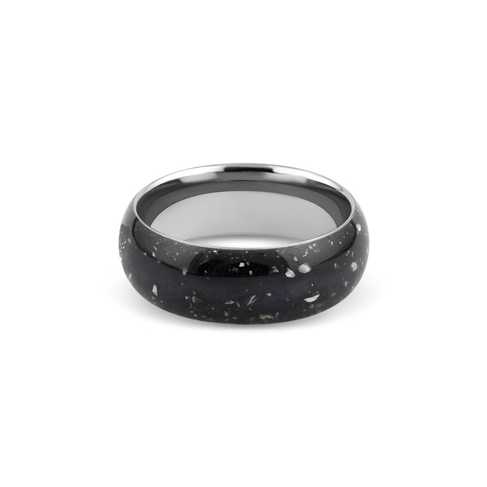 Wide sterling silver band ring featuring a continuous inlay of black resin with scattered white and silver flakes.