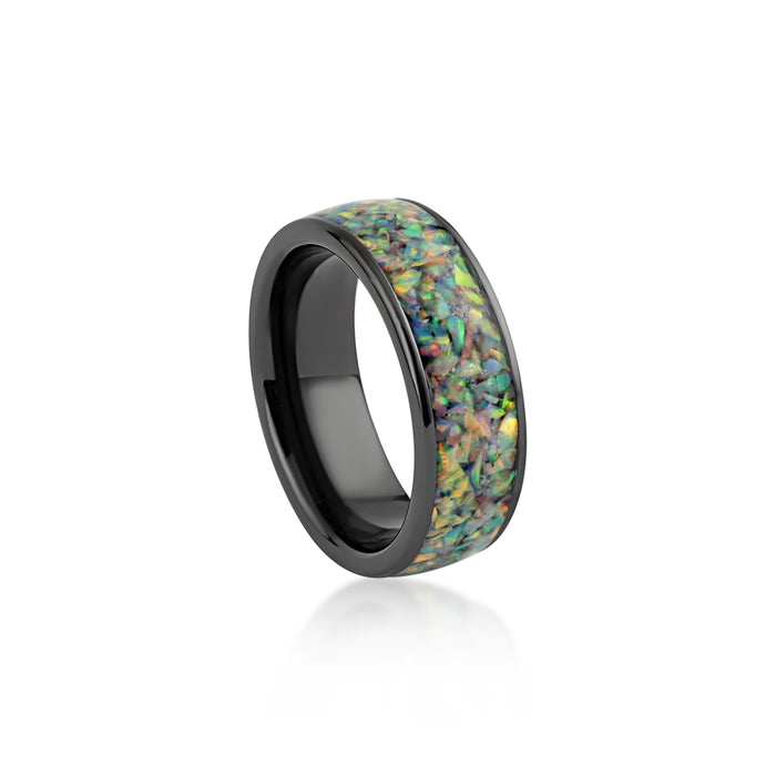 Wide black band ring featuring a continuous inlay of multicolored black opal resin.