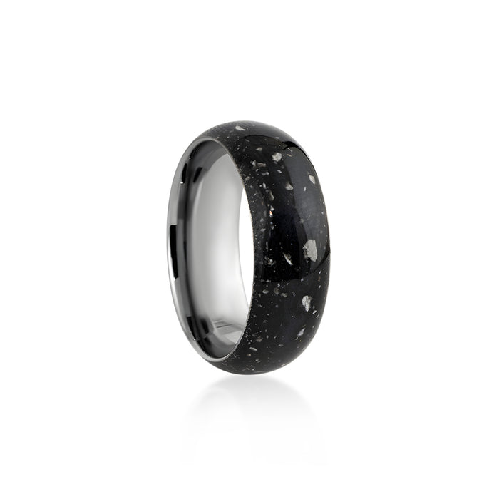 Wide sterling silver band ring featuring a continuous inlay of black resin with scattered white and silver flakes.