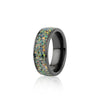 Angled view of the wide black band ring featuring a continuous inlay of multicolored black opal resin.
