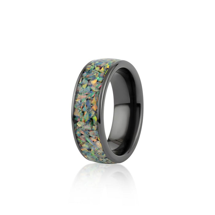Angled view of the wide black band ring featuring a continuous inlay of multicolored black opal resin.