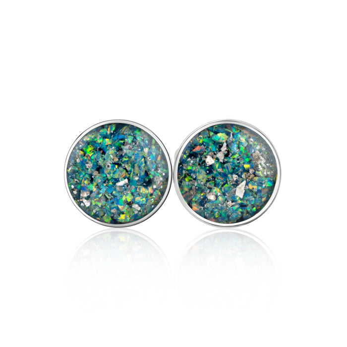 Pair of sterling silver stud earrings with round blue-green opal resin inlays and silver flakes.