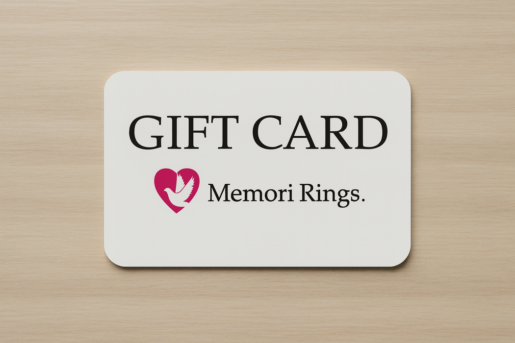 Memori Rings branded Gift card on a flat wooden surface.