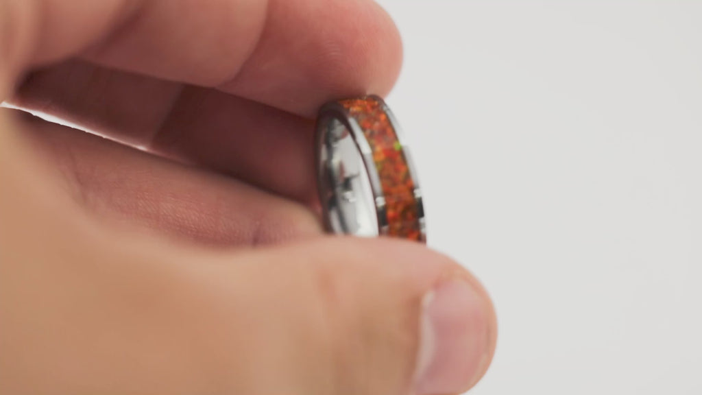 Video showing the Gunmetal Tungsten Ring rotating, detailing the bright orange fire opal inlay and silver flakes.