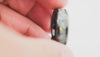 Demonstration video showing the 360-degree sparkle of the Black Ceramic Ring with multi-color fire opal inlay.